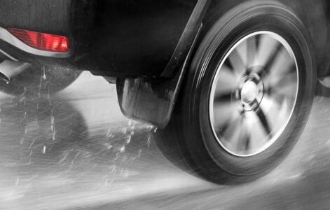 car tire driving through rain