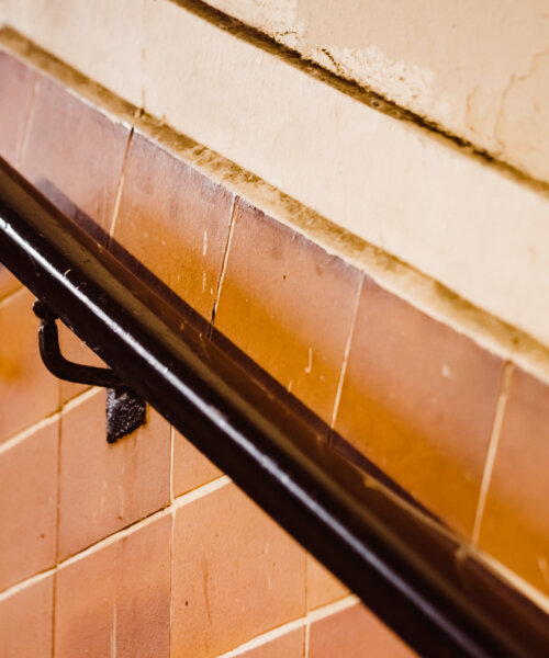 old railing at a railway station in closeup