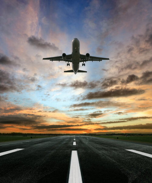 Passenger airplane taking of at sunrise