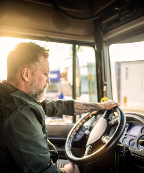 Photo of mid adult man driving a truck