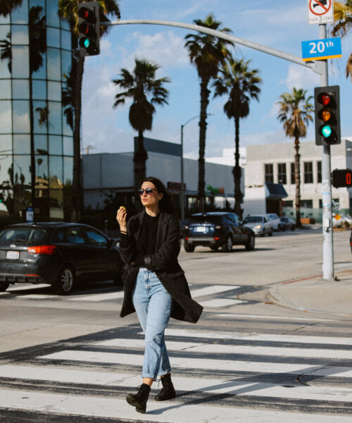 Woman commuting or just walking to do errands on the streets of Santa Monica, California.