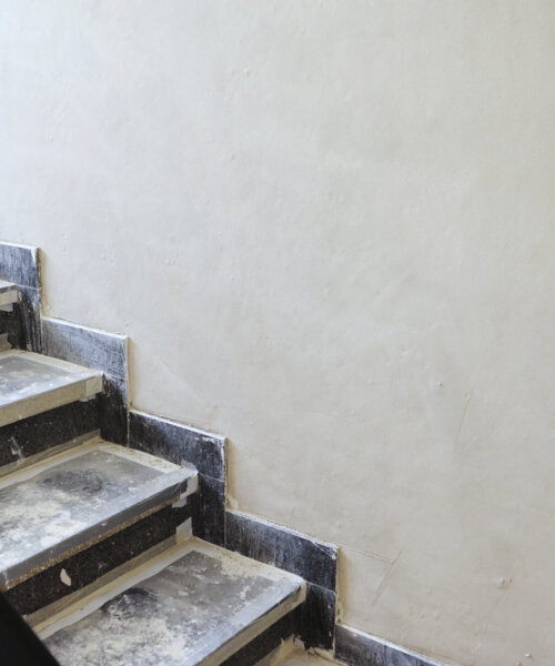 Construction site - plastering an apartments staircase