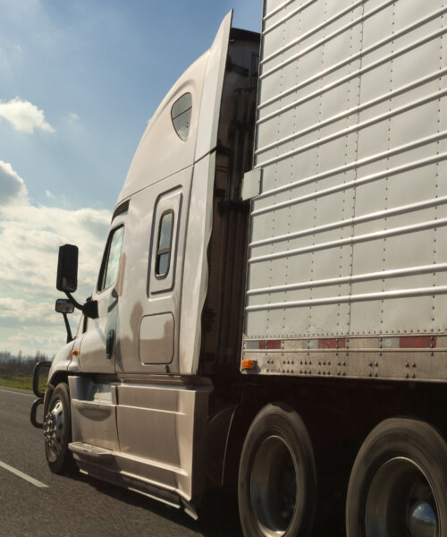 Side view of brown semi cab on Interstate 5 in Oregon. Horizontal