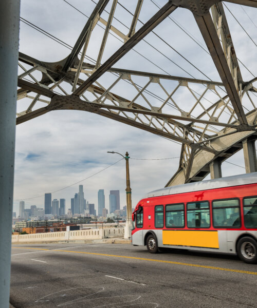 Bus moving across the 6th street bridge in LA.