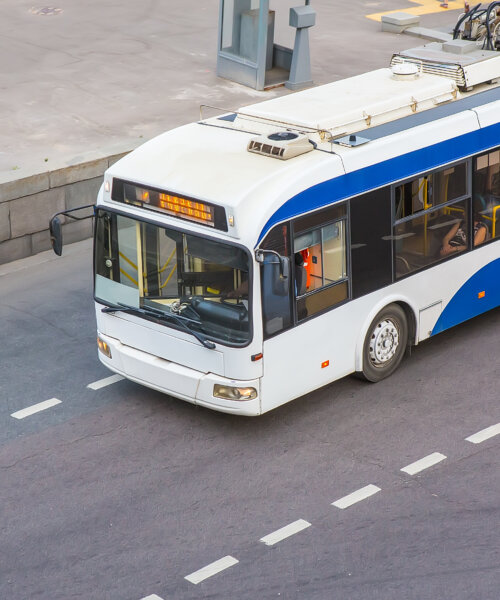 trolley moves along a city street top view