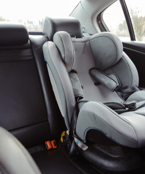 Child car seat for safety in the rear passenger seat of a car.