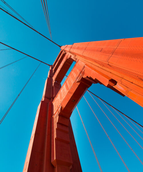 A low angle shot of the Golden Gate Bridge against the blue sky, San Fransico, California, USA