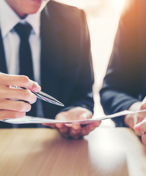 Business people Meeting negotiating a contract between two colleagues