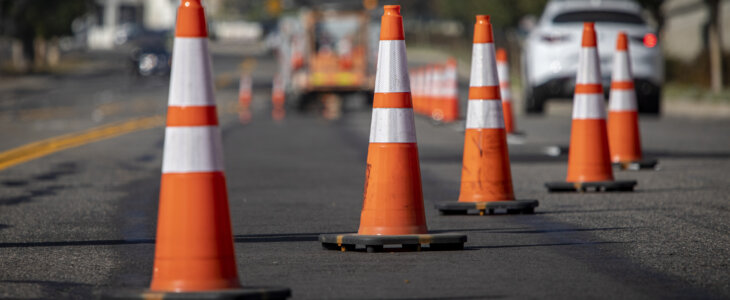 Traffic cones lined up in the road