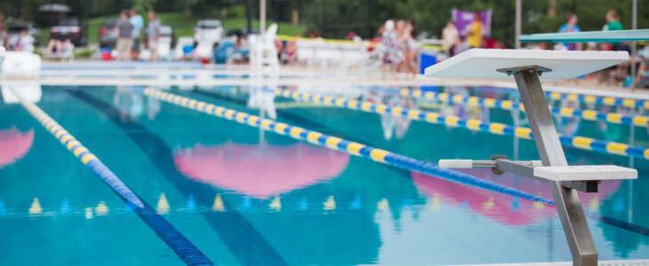 public swimming pool with people sitting in the distance