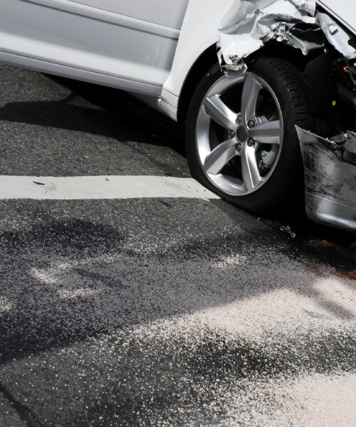 A white car just involved in a car crash