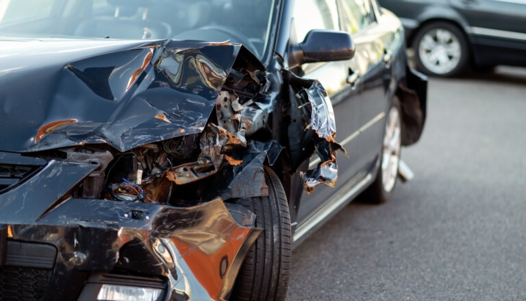 Close-up of damaged car part after accident