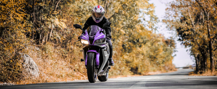Female biker enjoys motorcycle ride