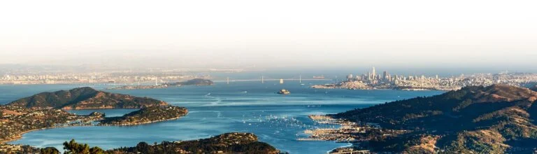 Scenic aerial view of San Francisco Bay with the Golden Gate Bridge, Alcatraz Island, and city skyline in the background