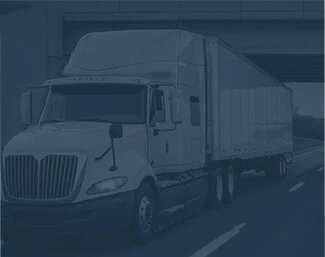 Semi-truck with trailer driving on a highway under an overpass