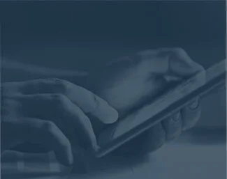 Close-up of hands holding and using a tablet device