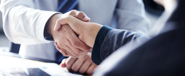 Business handshake in the office