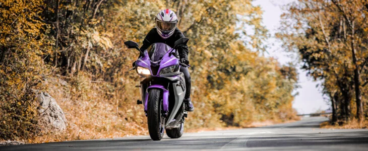 Female biker enjoys motorcycle ride